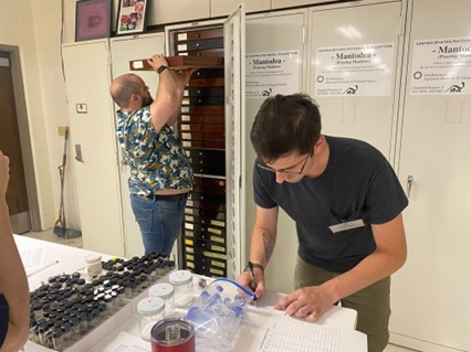 Profiling collections, drawer by drawer, to get an estimate of how much empty space is available in each cabinet. Photo by Michael Caballero, University of Texas at Austin.