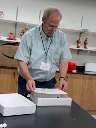 Learning how to package specimens properly from Dave Furth. Photo by L. Hart.
